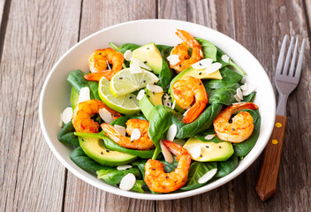 Salad with shrimps, avocado, spinach and almonds. Healthy eating. Diet.