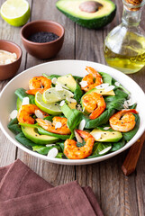 Salad with shrimps, avocado, spinach and almonds. Healthy eating. Diet.