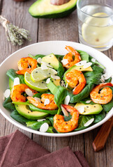 Salad with shrimps, avocado, spinach and almonds. Healthy eating. Diet.