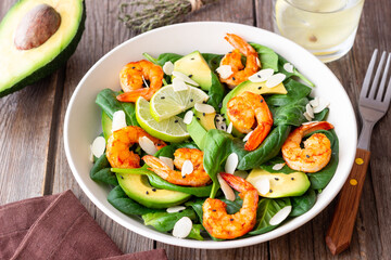 Salad with shrimps, avocado, spinach and almonds. Healthy eating. Diet.