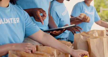 Group volunteering, tablet and food donation for community service, support and management with NGO checklist. Hands of people packaging groceries, planning on digital technology and charity project