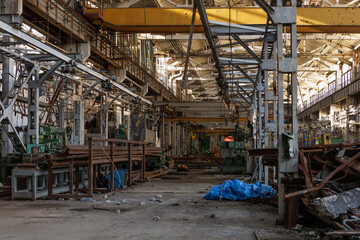 Destroyed and abandoned mechanical plant during war in Ukraine.