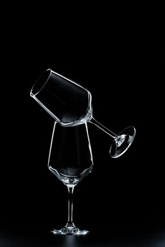 silhouette of wine glasses on black background