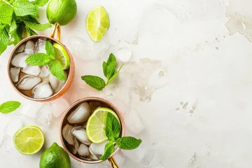 Afwasbaar Fotobehang Moskou Moscow mule or mint julep in copper mug with lime ginger beer vodka and mint White table top view copy space