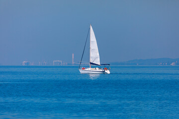 Fototapeta premium Sailing yacht in the Mediterranean sea on a background of blue sky . White yacht at blue sea