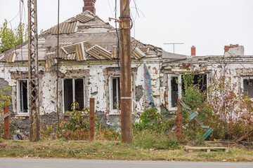 Destroyed and abandoned residental building during war in Ukraine.