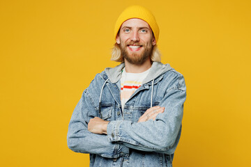 Young smiling cheerful cool blond man he wears denim shirt hoody beanie hat casual clothes hold...