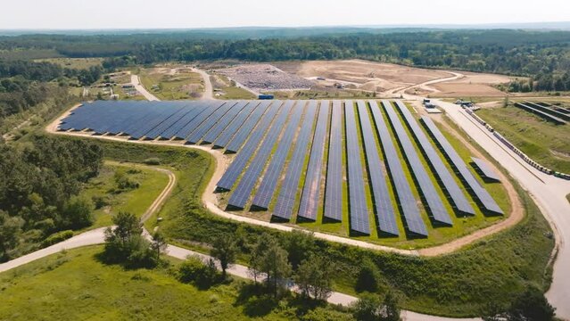 Drone backtracking over a solar panel farm in France