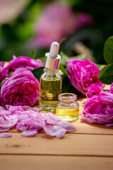 Obraz na płótnie Canvas rose essential oil, pink rose SPA and aromatherapy. Selective focus