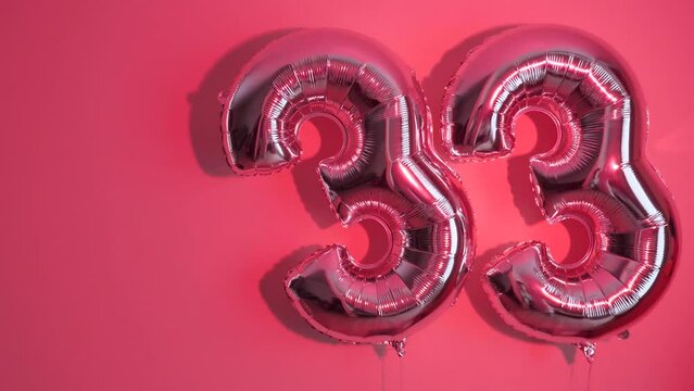 Party Happy Birthday Thirty-Three with Silver Grey number . Gel balls 33 for congratulations celebrations holiday. Close-up, neon lighting, no people