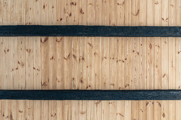 Texture of a wooden ceiling made of natural wood.