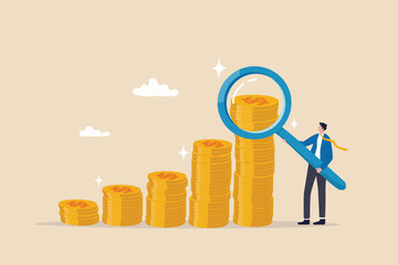 Investment or financial analysis, wealth management or revenue growth, economic or profit improvement, income or portfolio analysis concept, businessman with magnifying glass on growth coin stack. - obrazy, fototapety, plakaty