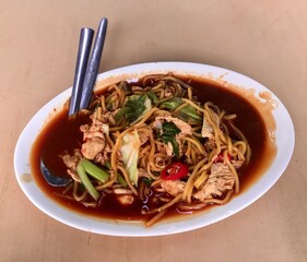 A plate of fried noodles at a restaurant
