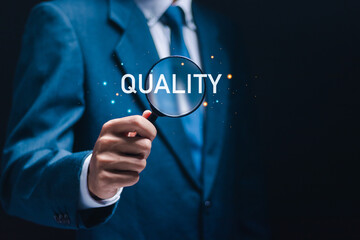 Validation concept, businessman use magnifying glass focus to quality word for quality assurance...