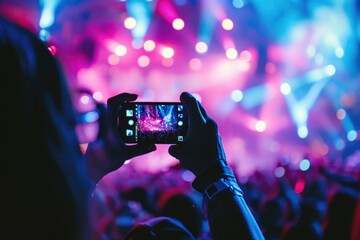 people use smart phones record video at music concert