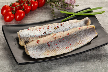 Marinated herring fillet with green onion - obrazy, fototapety, plakaty