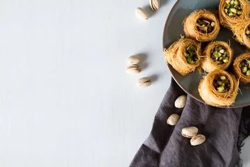 Foto op Plexiglas Traditional arabic dessert baklava with pistachios. White background © naltik