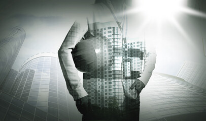 Engineer with hard hat and cityscapes, multiple exposure. Banner design with black and white effect
