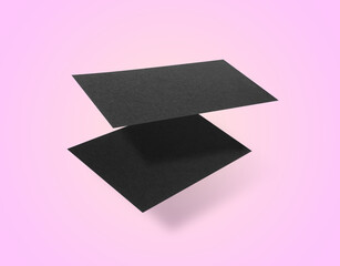 Blank business cards in air on pink background. Mockup for design