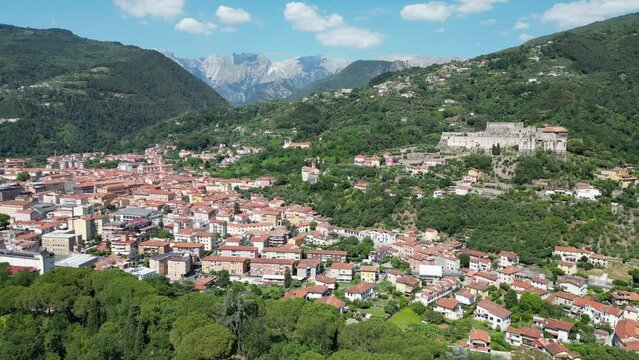 Sarzana City and Fortress with Mountain Background in Liguria, Italy - Aerial 4k
