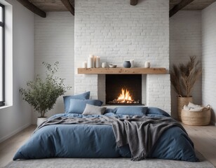 blue pillows and a coverlet is placed near a fireplace against a white brick wall, showcasing the modern, Scandinavian interior design of a loft bedroom.