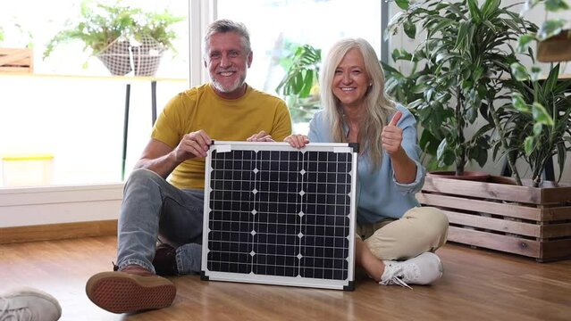 senior couple at home solar panel