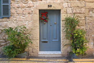 Fototapeta na wymiar Wooden grey door in downtown of Rabat, Malta