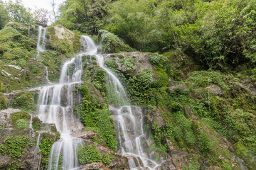 Fototapeta na wymiar Beautiful cascading Bakthang waterfall in the Himalayan valley in Sikkim, India
