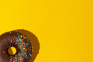 chocolate donuts on a yellow background