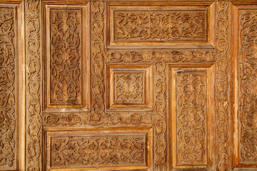 beautiful wooden door design in a historical fashion in the entrance of a historical place