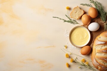 Ingredients for bakery products. Flour with flowers, eggs, bread and butter on light textured background. Healthy food concept. Flat lay, top view with copy space 