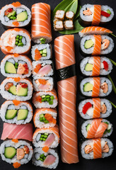 Classic, tasty sushi rolls presented on black backdrop