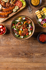 Delicious salad added to grilled dishes, with bacon and halloumi cheese.