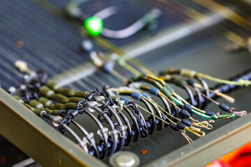 Carpfishing session at the Lake.Carp fishing hooks.fishing hooks are equipped with leashes for...