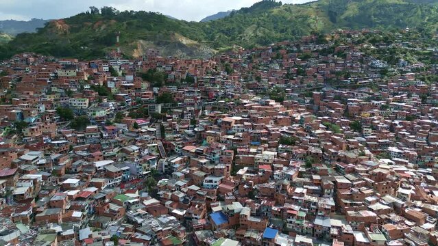 High Aerial Drone View of Comuna 13 Neighborhood, Medellin, Colombia. Traditional Brick Houses