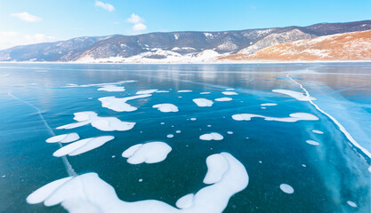 Beautiful clear ice with cracks on the Lake Baikal -  Clean, cool ice and cleanest lake in the...