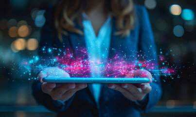 Business woman wearing suit hand holding tablet overlay with digital blue and pink hologram data.