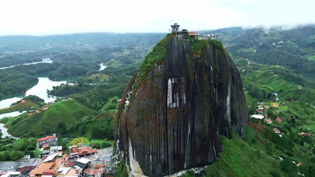 Close Aerial drone shot of El Penon de Guatape near Medellin, Colombia. Big Stone