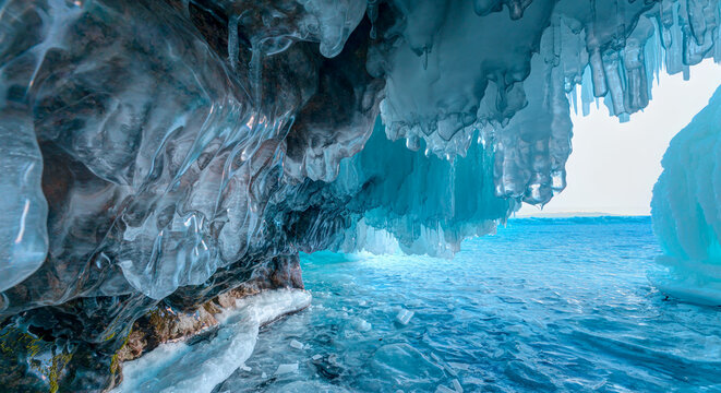 Inside the turquoise ice cave - ice cave winter frozen nature background landscape - Lake Baikal, Siberia, Eastern Russia