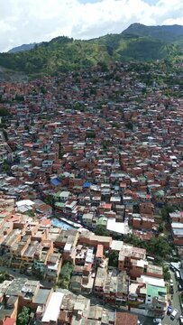 Arc Drone Shot of Comuna 13 Neighborhood, Medellin, Colombia. Traditional Brick Houses