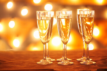 Champagne glasses on golden background