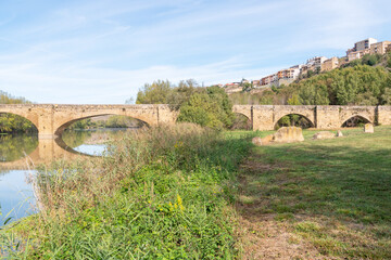 Fototapeta na wymiar Medieval bridge over Ebro River. San Vicente de la Sonsierra.