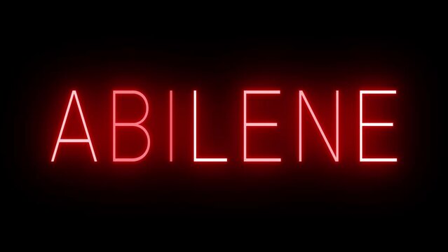 Flickering red retro style neon sign glowing against a black background for ABILENE