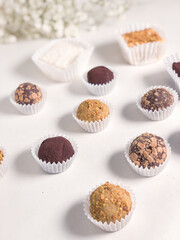 A pattern of truffle and bird's milk candies, side view