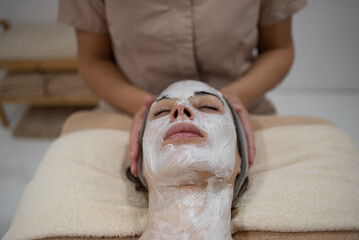 Woman receiving aesthetic and facial treatment at a professional clinic