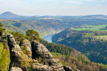 View of Sandstone rock formations in the Elbe River Valley, Saxon Switzerland (Sächsische Schweiz) National Park, Saxony, Germany. Elbe Sandstone Mountains - obrazy, fototapety, plakaty