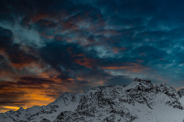 Dramatic sky at sunset over the Alps mountains, fine art landscape 