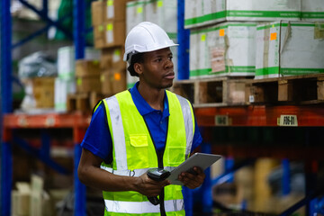 Male american african factory company employee scanning box checking number of products on goods...