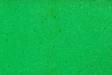 Texture of green soft synthetic material of kitchen cleaning sponge