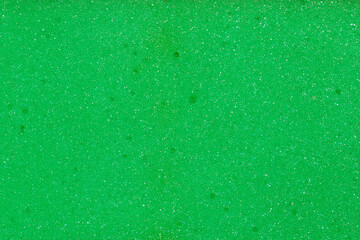 Texture of green soft synthetic material of kitchen cleaning sponge